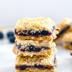 Almond Blueberry Bars -- These crumbly Almond Blueberry Bars are incredibly easy to make and packed with summery blueberry flavor. They make the perfect dessert, snack... Or even breakfast! | wearenotmartha.com