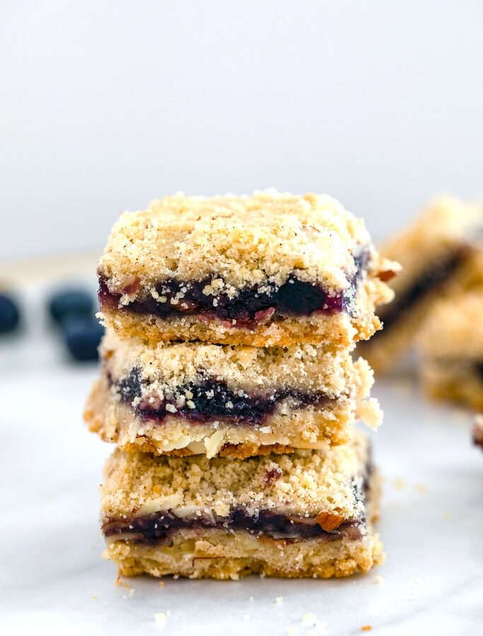 Almond Blueberry Bars -- These crumbly Almond Blueberry Bars are incredibly easy to make and packed with summery blueberry flavor. They make the perfect dessert, snack... Or even breakfast! | wearenotmartha.com