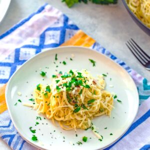 Angel Hair Alfredo with Jalapeño and Pancetta -- This easy-to-make Angel Hair Alfredo with Jalapeño and Pancetta is the kind of delicious comfort food that leaves you feeling satisfied instead of weighed down and yucky. And because it's so quick to make, it's the ideal weeknight dinner | wearenotmartha.com
