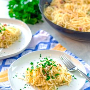 Angel Hair Alfredo with Jalapeño and Pancetta -- This easy-to-make Angel Hair Alfredo with Jalapeño and Pancetta is the kind of delicious comfort food that leaves you feeling satisfied instead of weighed down and yucky. And because it's so quick to make, it's the ideal weeknight dinner | wearenotmartha.com