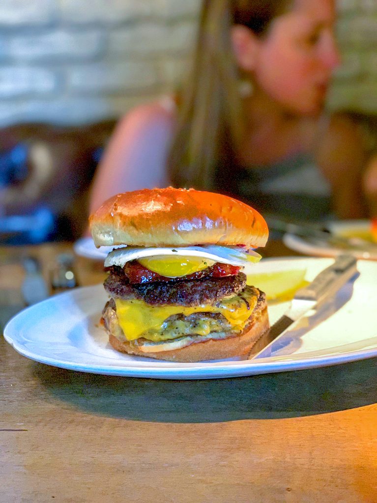 Head-on view of the double cheeseburger with bacon and egg from Au Cheval in Chicago