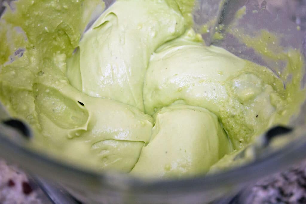 Avocado mousse blended smooth in blender