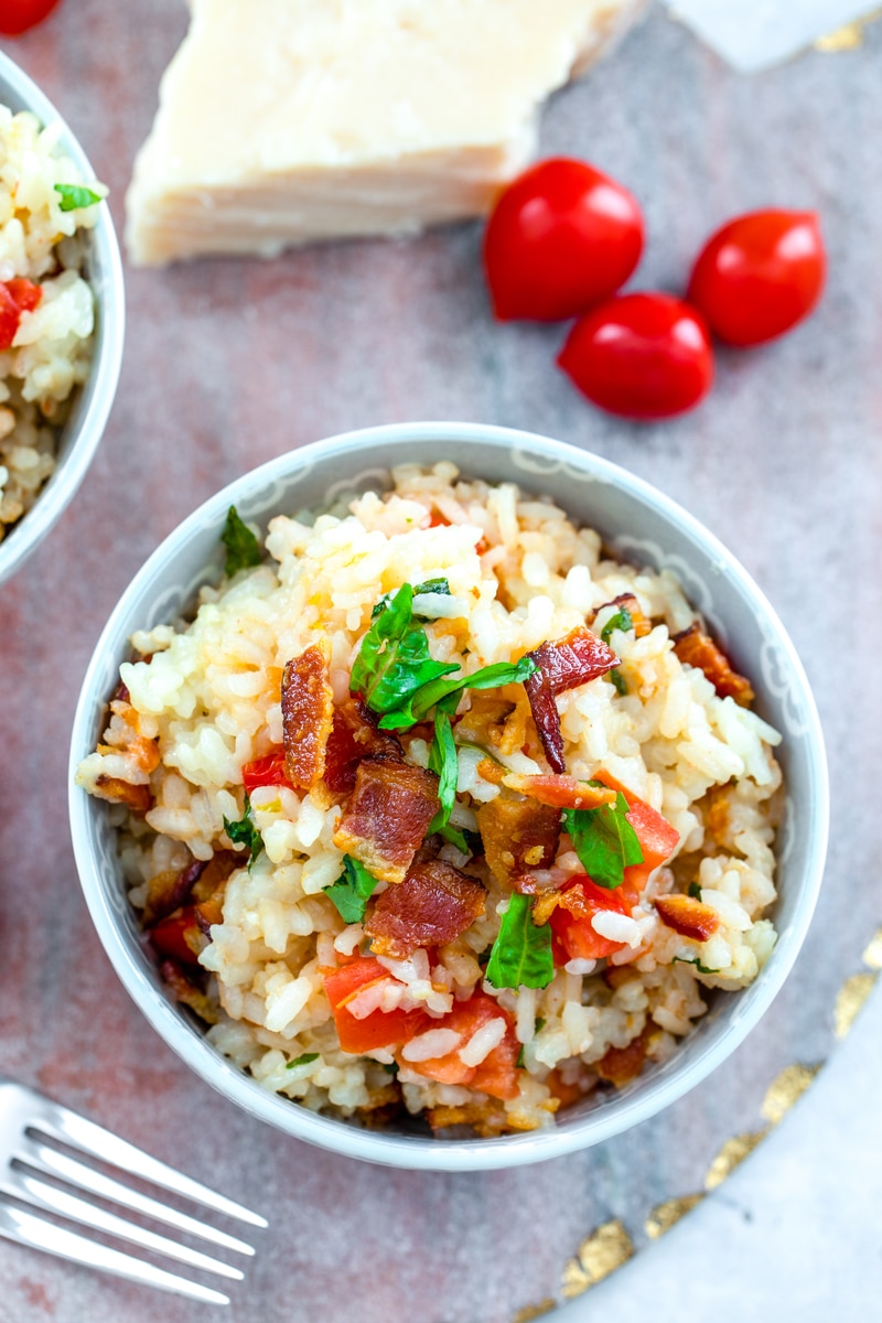 Bacon, Basil, and Tomato Risotto -- BLT risotto sounds lovely, but an easy swap of lettuce for basil makes for a much more enjoyable dish and this Bacon, Basil, and Tomato Risotto is the ultimate summer dinner | wearenotmartha.com #risotto #BLTs #baconrecipes #easydinners #easyrecipes