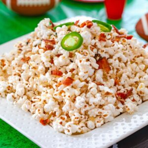 Bacon Jalapeño Cheddar Popcorn -- This Bacon Jalapeño Cheddar Popcorn is the perfect football watching party snack. It's a little bit spicy, a little bit cheesy, and packed with flavor | wearenotmartha.com