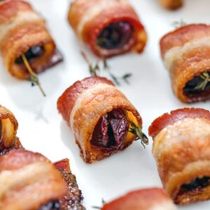 Bacon Wrapped Cherries with Thyme -- Your search for the perfect easy summer appetizer is over! These Bacon Wrapped Cherries with Thyme involve just three ingredients and are incredibly unique bite-sized party apps | wearenotmartha.com