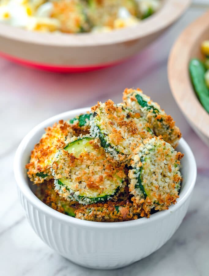 Baked Zucchini Chips -- What to do with all that summer zucchini? These Baked Zucchini Chips are deliciously flavorful and healthy and have the most satisfying crunch. Enjoy them as a side dish, snack, or salad topper! | wearenotmartha.com