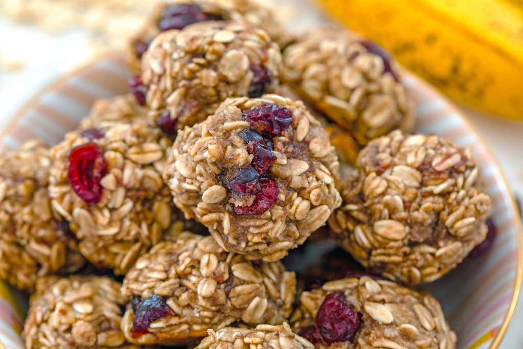 Landscape closeup view of banana maple cranberry cookies in a bowl