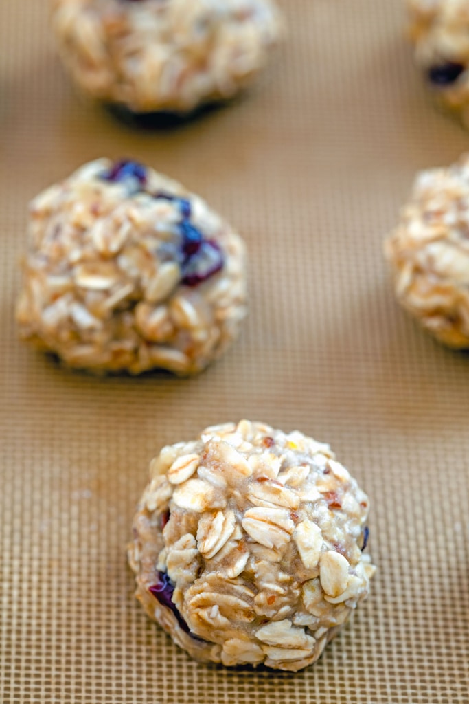 Banana maple cranberry cookies formed on a Silpat and ready to go into oven