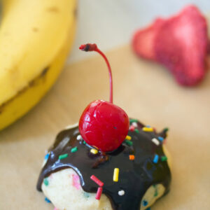 Banana Split Cookies -- Banana strawberry cookies with chocolate sauce, marshmallow, sprinkles, and a cherry on top! | wearenotmartha.com