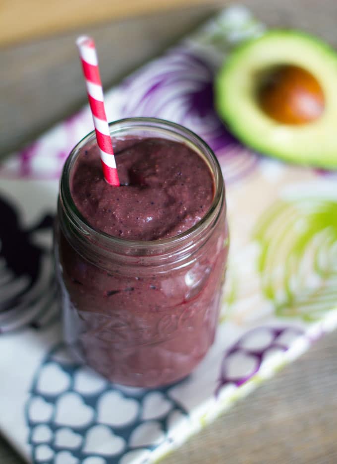 Beet Avocado Smoothie -- Have you ever had a beet smoothie? Don't be scared! This smoothie is packed with sweet flavor from beets, avocado, berries, and spinach and is a healthy addition to your diet | wearenotmartha.com