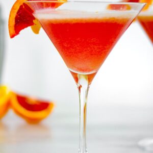 Blood Orange Meyer Lemon Gin Sour -- Winter citrus combines with gin and a little maple syrup for this Blood Orange Meyer Lemon Gin Sour. The vibrant color of a blood orange cocktail will always impress guests | wearenotmartha.com