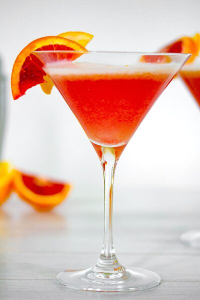 Blood Orange Meyer Lemon Gin Sour -- Winter citrus combines with gin and a little maple syrup for this Blood Orange Meyer Lemon Gin Sour. The vibrant color of a blood orange cocktail will always impress guests | wearenotmartha.com