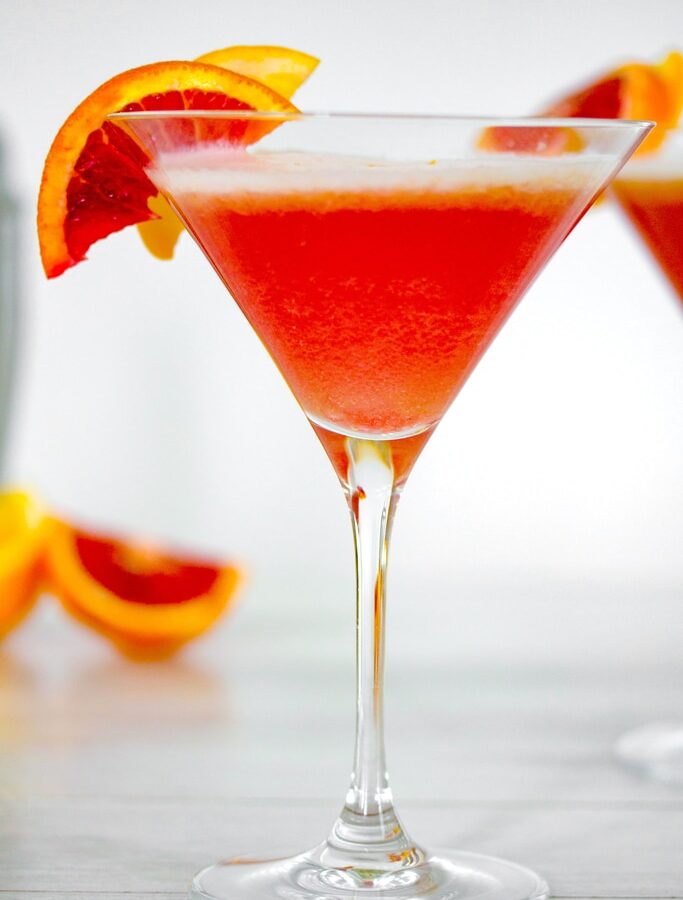 Blood Orange Meyer Lemon Gin Sour -- Winter citrus combines with gin and a little maple syrup for this Blood Orange Meyer Lemon Gin Sour. The vibrant color of a blood orange cocktail will always impress guests | wearenotmartha.com