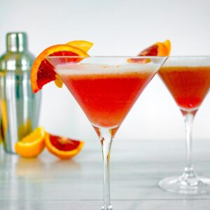 Winter citrus combines with gin and a little maple syrup for this Blood Orange Meyer Lemon Gin Sour. The vibrant color of a blood orange cocktail will always impress guests!