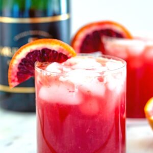 Blood Orange Sparkler -- This Blood Orange Sparkler is a simple blood orange cocktail with a splash of ginger ale and champagne. It's a lovely winter brunch cocktail, but can be enjoyed any time of day! | wearenotmartha.com