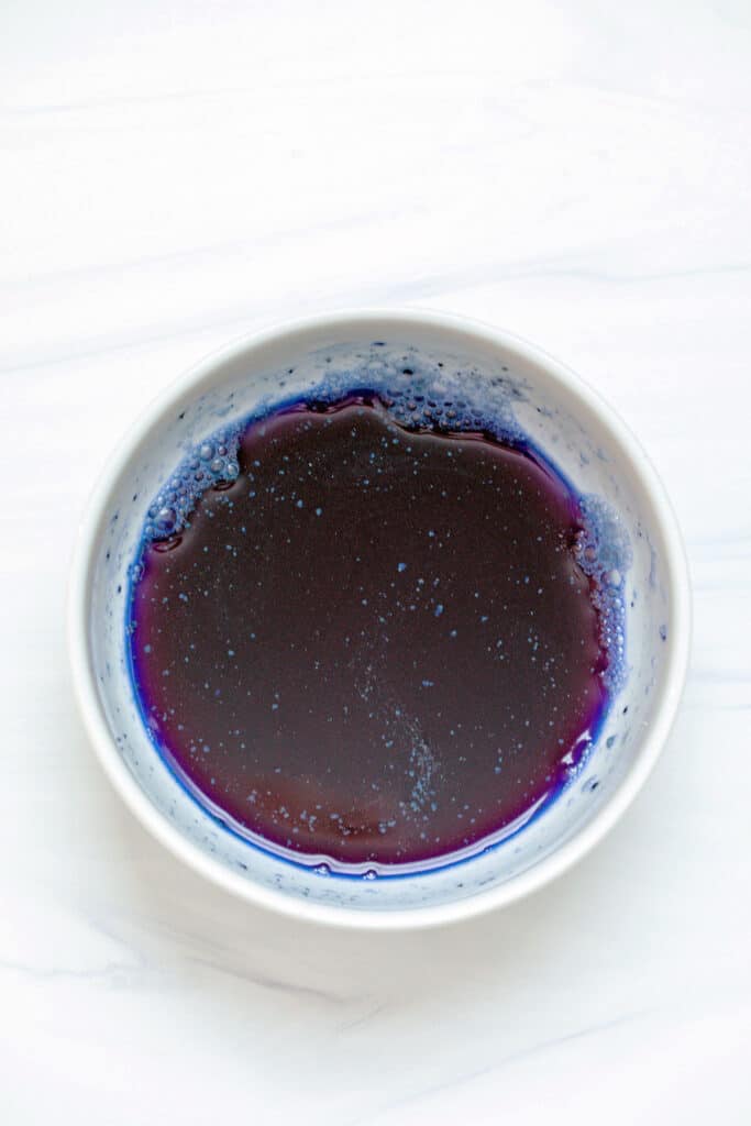 Blue liquid in white bowl