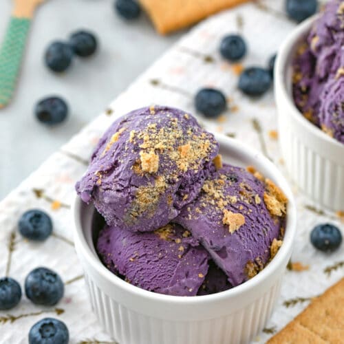Blueberry Cheesecake Ice Cream -- A completely decadent Blueberry Cheesecake Ice Cream that's actually a little bit lighter than the average ice cream? Yes! Plus, this ice cream is an absolutely gorgeous color and packed with fresh blueberry flavor | wearenotmartha.com
