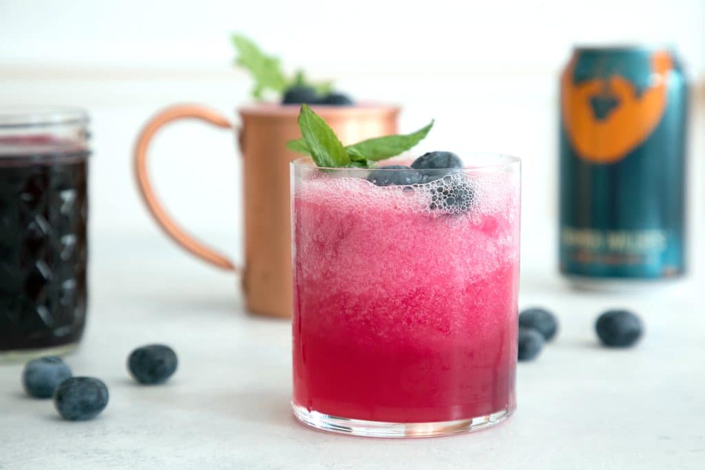 Blueberry Frozen Moscow Mules -- Ginger beer, vodka, and blueberry simple syrup are blended with crushed ice for this summertime frozen cocktail | wearenotmartha.com