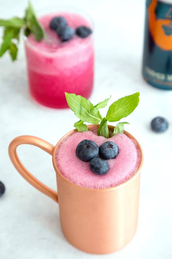 Blueberry Frozen Moscow Mules -- Ginger beer, vodka, and blueberry simple syrup are blended with crushed ice for this summertime frozen cocktail | wearenotmartha.com