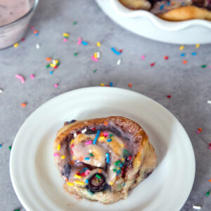 Blueberry Funfetti Cinnamon Rolls -- The perfect addition to brunch, these cinnamon rolls are packed with blueberries and rainbow sprinkles | wearenotmartha.com