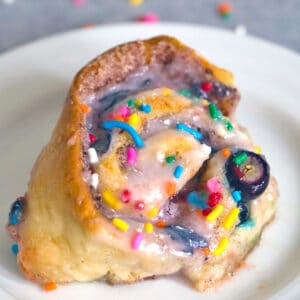 Blueberry Funfetti Cinnamon Rolls -- Is there anything better than a plate full of cinnamon rolls? How about a plate full of Blueberry Funfetti Cinnamon Rolls? These will make your kitchen smell amazing and are the perfect addition to weekend brunch | wearenotmartha.com