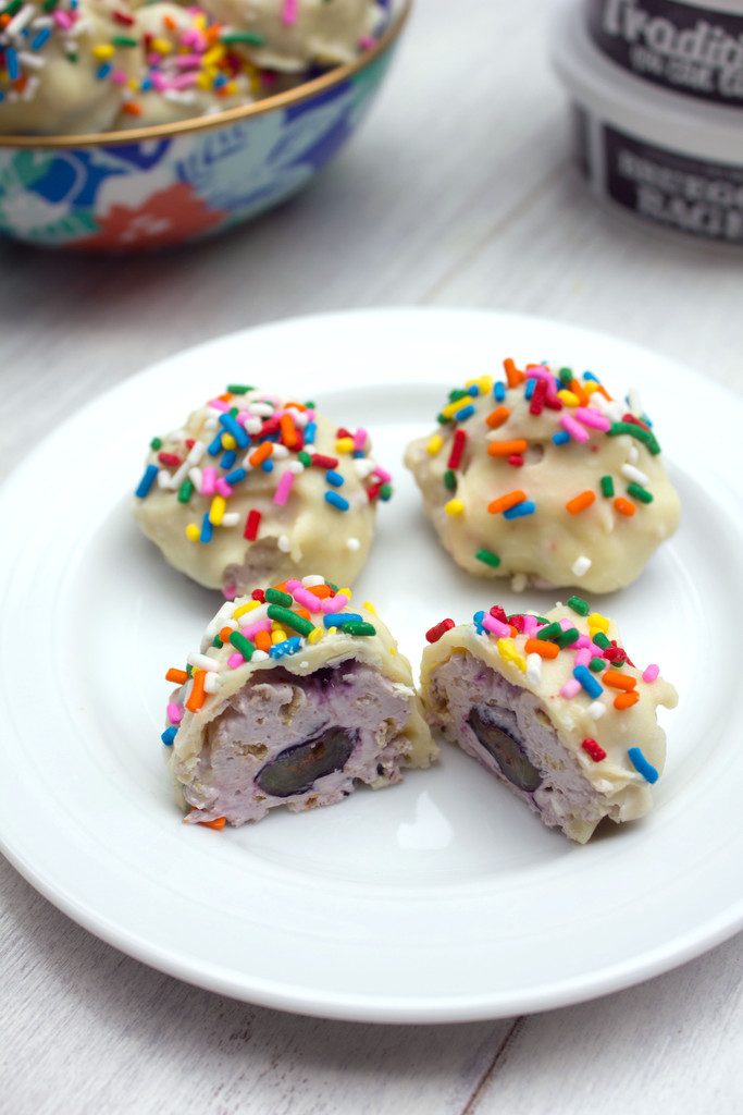 Blueberry Greek Cheesecake Truffles -- Blueberry cream cheese combined with fresh blueberries and graham crackers and dunked in white chocolate | wearenotmartha.com