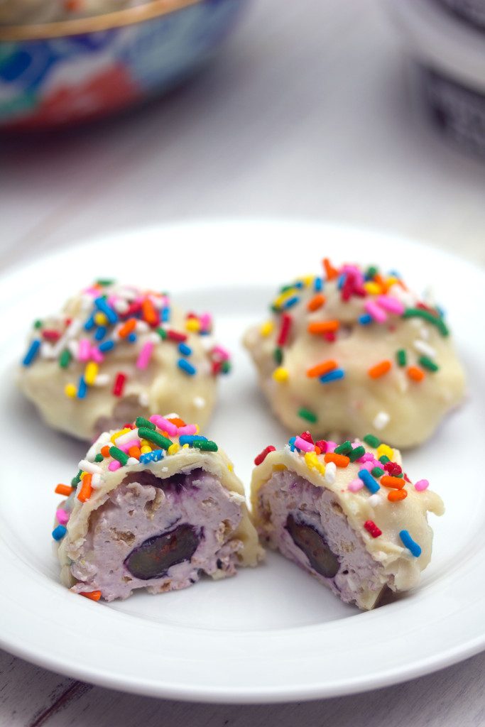 Blueberry Greek Cheesecake Truffles -- Blueberry cream cheese combined with fresh blueberries and graham crackers and dunked in white chocolate | wearenotmartha.com