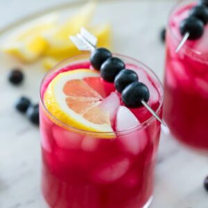 Blueberry Vodka Lemonade -- There's nothing quite like a glass of cold lemonade on a hot summer day. Unless it's a glass of cold Blueberry Vodka Lemonade! This summer cocktail is the perfect balance of tart and sweet and can also easily be made into a blueberry lemonade mocktail | wearenotmartha.com