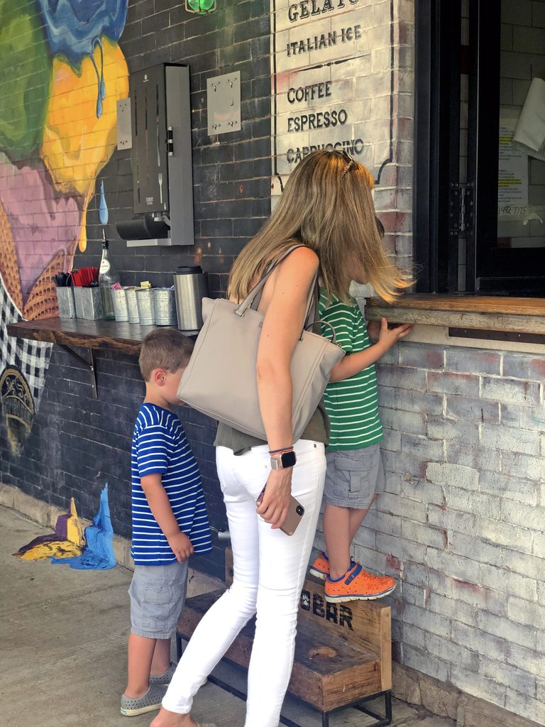 Sues, Charlie, and Henry ordering donuts at Chicago's BomboBar