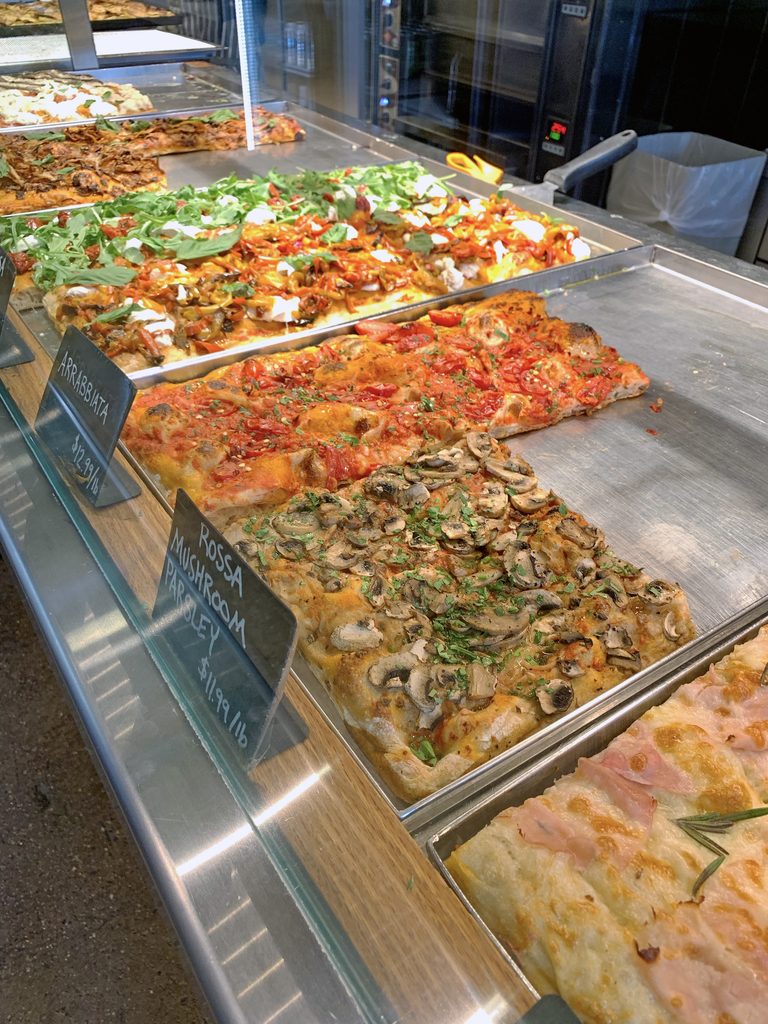 View of all of the various types of Italian style pizza at Bonci in Chicago