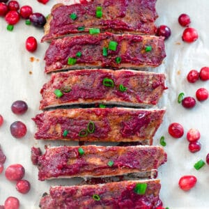 Bourbon Cranberry Baby Back Ribs -- These Bourbon Cranberry Baby Back Ribs are baked with a simple spice rub and then smothered with a bourbon cranberry BBQ sauce. They're perfect for serving during the holiday season, but are delicious all winter long! | wearenotmartha.com #babybackribs #cranberrysauce #cranberries #bourboncranberry #holidaydinners