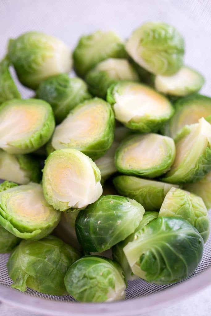 Brussels sprouts halved and just blanched in a strainer