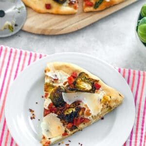 Brussels Sprouts and Pancetta Flatbread -- The key to getting anyone to love brussels sprouts? Add them to pizza! This Brussels Sprouts and Pancetta Flatbread is sure to win everyone over | wearenotmartha.com