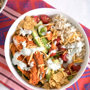 Buffalo Chicken Burrito Bowl -- This salad is packed with buffalo chicken, brown rice, avocado, tomato, and more | wearenotmartha.com