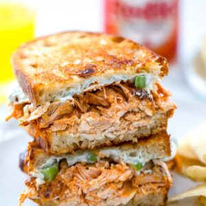 Buffalo Chicken Grilled Cheese -- Two of life's most delicious foods are combined into one perfect sandwich with this Buffalo Chicken Grilled Cheese. With a creamy blue cheese spread and plenty of spicy chicken and sharp cheddar cheese, you'll be craving this sandwich for both lunch and dinner | wearenotmartha.com