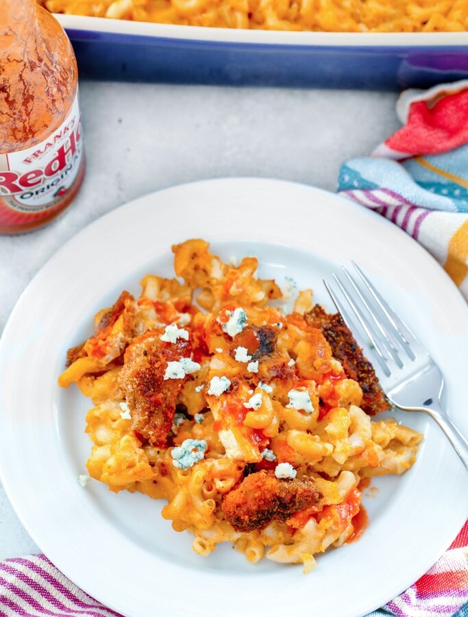 Buffalo Chicken Mac and Cheese -- This Buffalo Chicken Mac and Cheese is deliciously spicy, ridiculously cheesy, and basically the best comfort food ever. It makes for a wonderful dinner (with a salad on the side!) and is also perfect for serving in appetizer-sized portions at parties | wearenotmartha.com