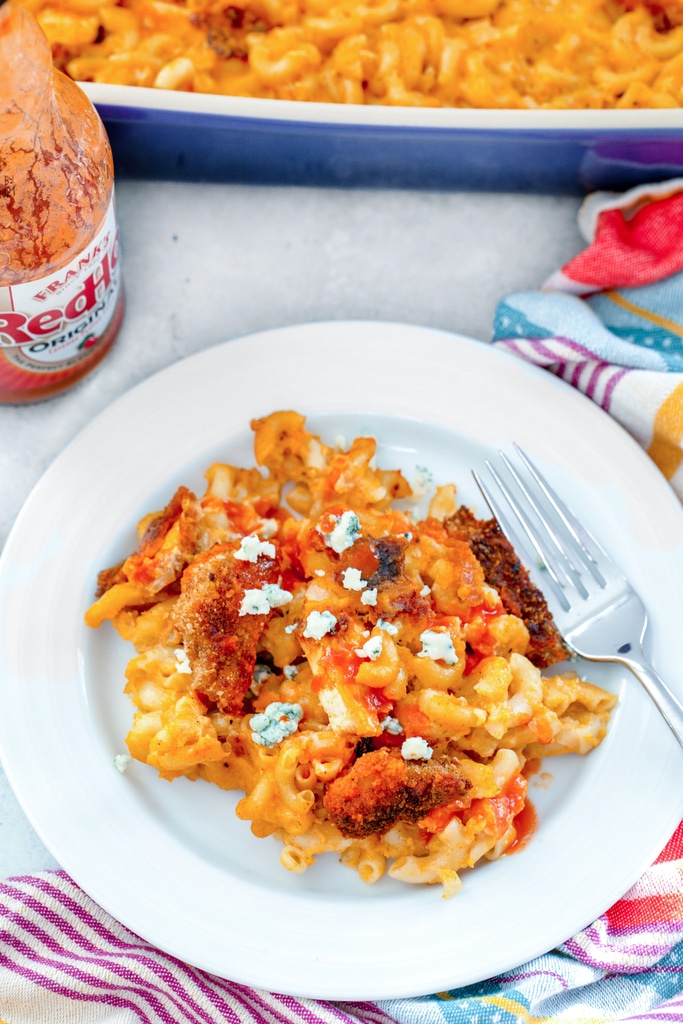 Buffalo Chicken Mac and Cheese -- This Buffalo Chicken Mac and Cheese is deliciously spicy, ridiculously cheesy, and basically the best comfort food ever. It makes for a wonderful dinner (with a salad on the side!) and is also perfect for serving in appetizer-sized portions at parties | wearenotmartha.com