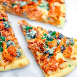 Buffalo Chicken Pizza -- If you love buffalo chicken and can't get enough pizza, you will be obsessed with this Buffalo Chicken Pizza. Make it with a rotisserie chicken for an incredibly easy weeknight dinner | wearenotmartha.com