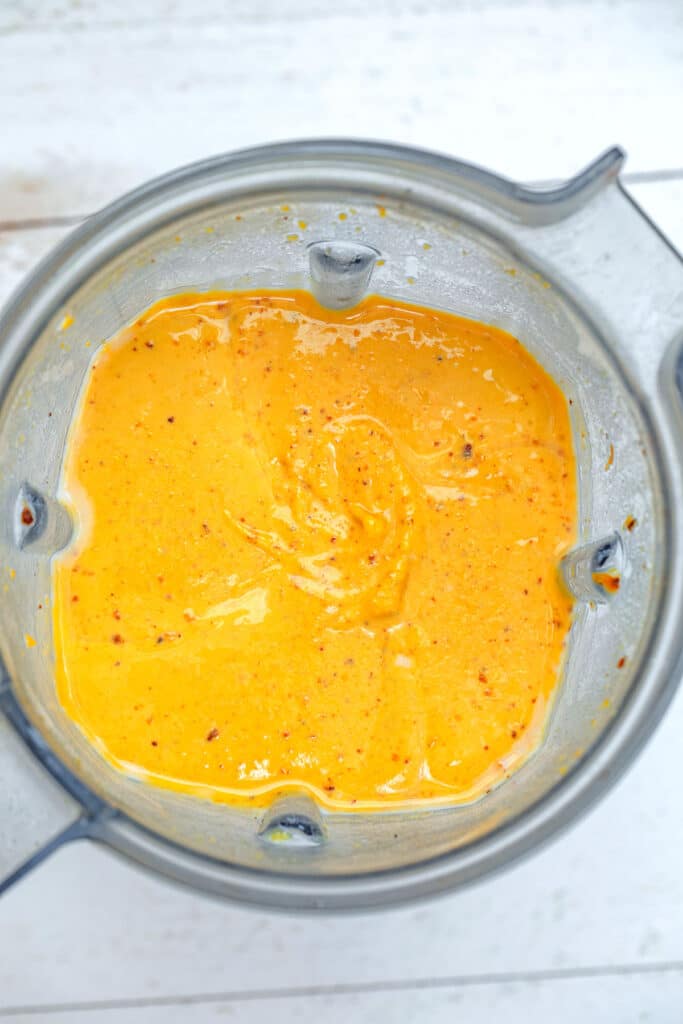 Overhead view of butternut squash sauve in blender