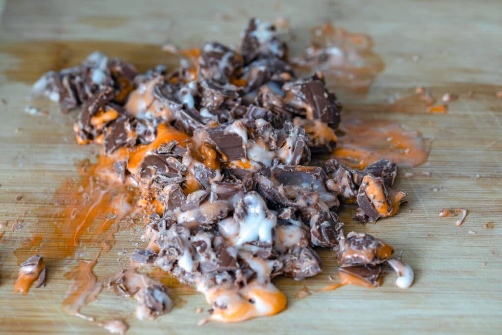View of chopped Cadbury Creme Eggs on cutting board