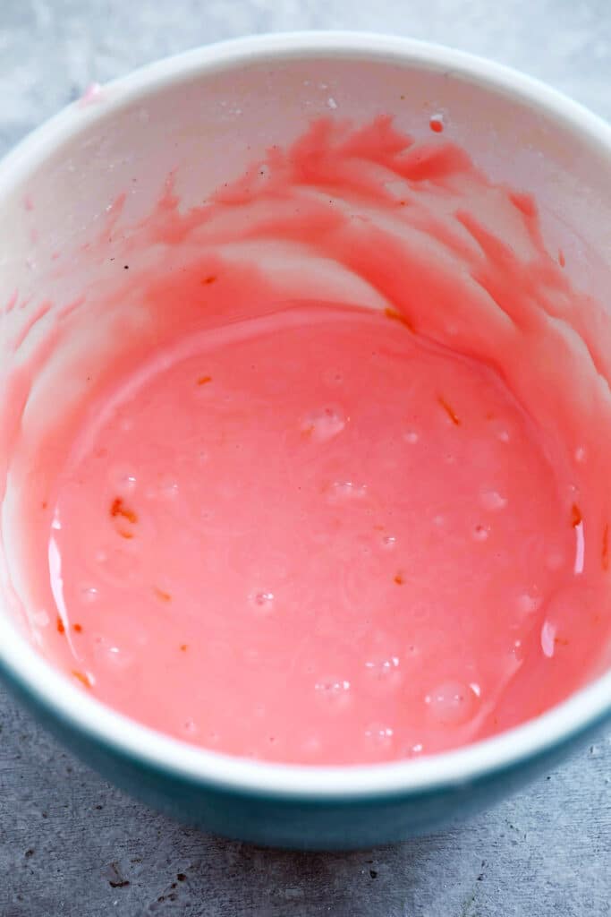 Overhead view of Campari icing in bowl