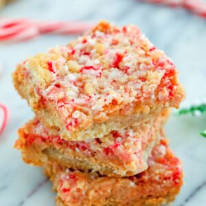 These simple shortbread bars are packed with holiday flavor thanks to candy canes. Candy Cane Crumble Bars make a fabulous addition to your holiday cookie platters!