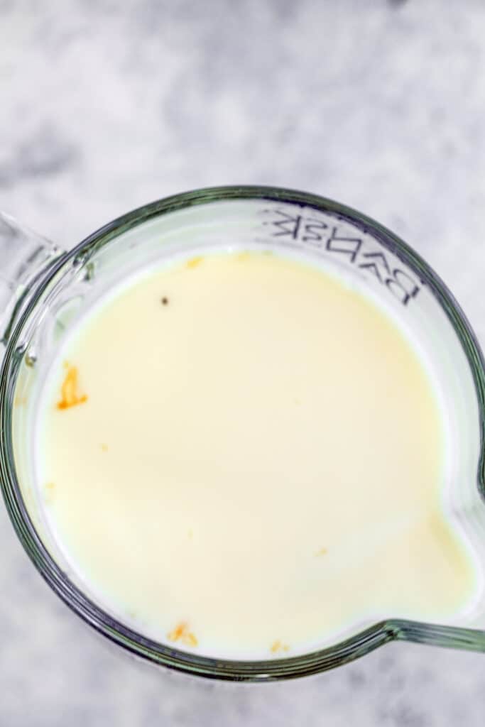 White jello layer mixture in measuring cup