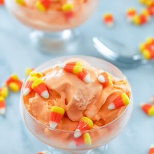 Candy Corn Ice Cream -- Candy corn season doesn't last very long, so you should take full advantage of it with this deliciously creamy Candy Corn Ice Cream! It's the perfect Halloween treat | wearenotmartha.com