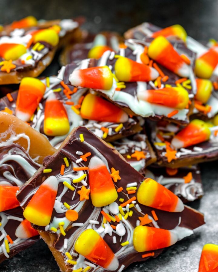 Candy Corn Toffee -- Candy corn fans, rejoice! This Candy Corn Toffee takes the much contested Halloween candy and turns it into a traditional favorite -- toffee! Include it in your Halloween treat spread for all your candy corn loving friends | wearenotmartha.com #candycorn #candycornrecipes #toffee #toffeerecipes #halloweenrecipes