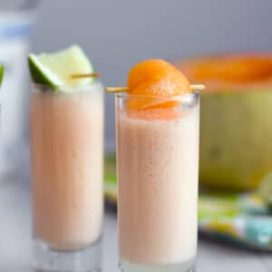 Cantaloupe Boozy Smoothie Shooters -- These cantaloupe boozy smoothie shooters are the perfect party sippers. Made with a few simple ingredients you don't often find together, they have just a little vodka kick | wearenotmartha.com