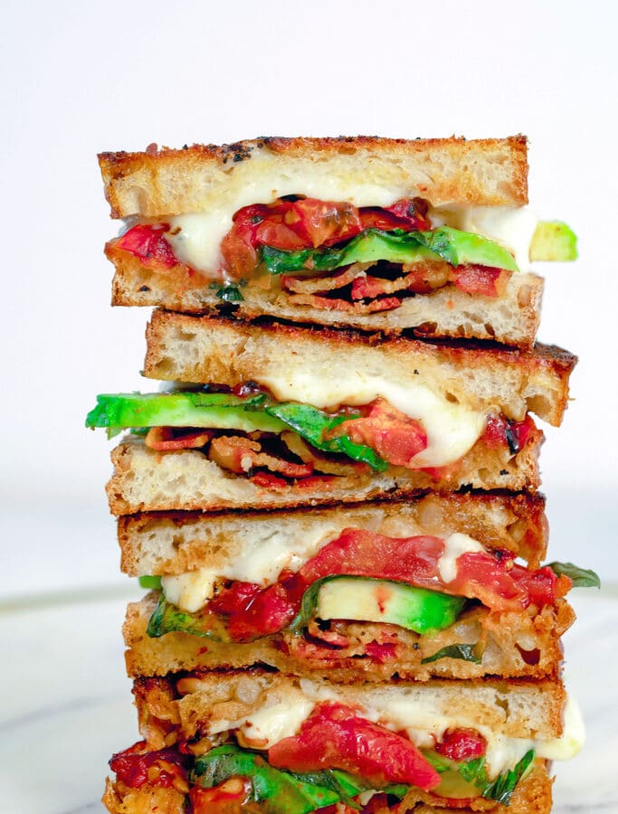 Caprese Grilled Cheese with Avocado and Bacon -- Take the caprese sandwich to whole new levels with this Caprese Grilled Cheese Sandwich with roasted tomatoes, basil, mozzarella, avocado and bacon | wearenotmartha.com