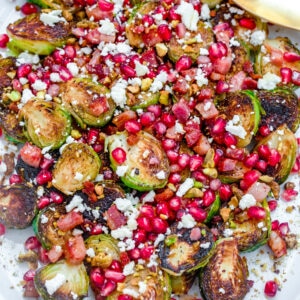 Caramelized Brussels Sprouts with Pancetta, Pomegranate, and Feta -- These Caramelized Brussels Sprouts make for the most festive holiday side dish... But they're also a simple-to-make vegetable side that can be enjoyed all winter long! | wearenotmartha.com