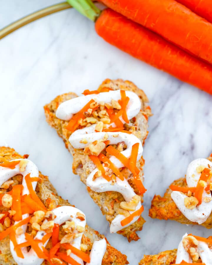 Chai Carrot Cake Scones -- These Chai Carrot Cake Scones with cream cheese frosting combine everything you love about carrot cake into a perfectly spiced treat that's delicious for dessert or breakfast! | wearenotmartha.com #carrotcake #scones #chai