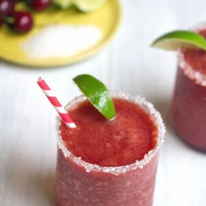 Cherry Lime Margarita -- This Cherry Margarita mixes fresh cherries and lime for a very summery combo... Just add tequila and blend to enjoy a refreshing frosty summer drink! | wearenotmartha.com